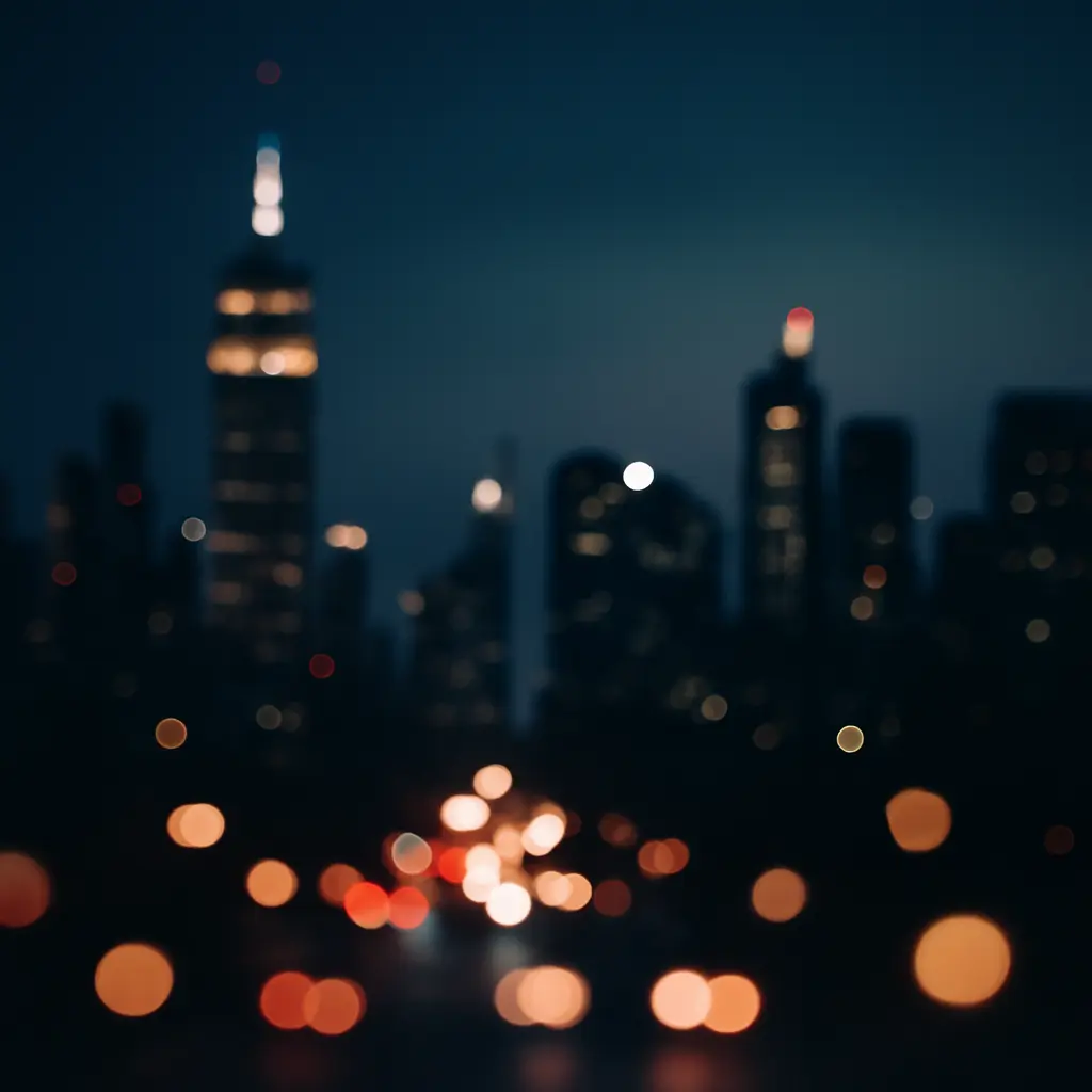 Noční panorama města s rozostřenými světly a výrazným bokehem